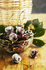 ripe cherries,ice cubes on wooden table, selective focus