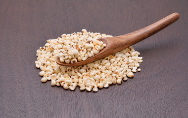 millet grains on the wooden floor