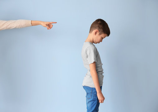 Family problems concept. Mother punishing son