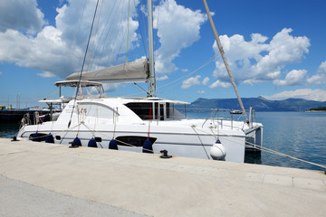 Fototapeta premium The sail yacht is in harbor, Corfu island, Greece