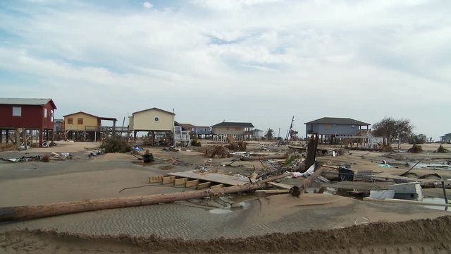 Debris and sand in flood-damaged residential area after a hurricane