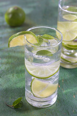 Nutritious detox water with lime and mint in a glass