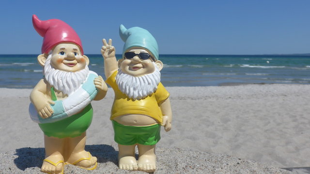 Two garden gnomes  on vacation at sea 