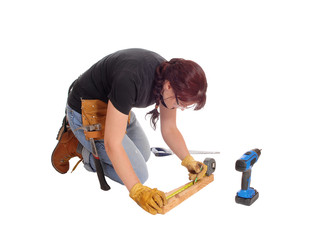 Woman working with tools.