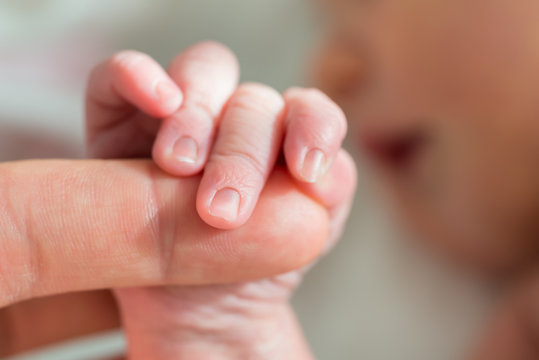 Baby Holding Mother's Finger