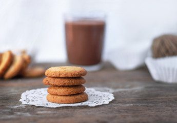  Butter cookies closeup  on Rustic Wooden Background with a cup
