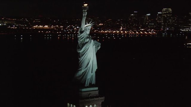 Flight around Statue of Liberty at night