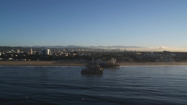 Flying south past the Santa Monica pier, smog in valley behind. Shot in 2010.