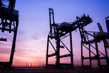 Cargo port in the evening，The silhouette of gantry crane