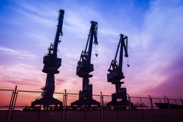 Cargo port in the evening，The silhouette of gantry crane