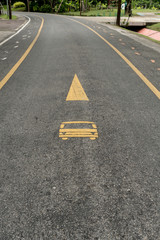 Bus lane sign on asphalt road