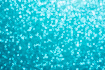 Fototapeta na wymiar Festive blur blue glitter bokeh background