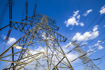 Pylon under the blue sky white clouds
