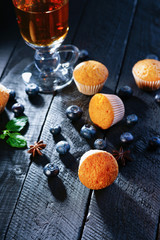 Tea cup, muffins and blueberry