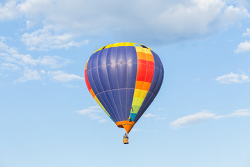 Fototapeta na wymiar Colorful hot air balloon on blue sky