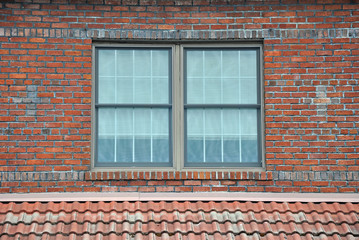 Window in old brick and mortar wall