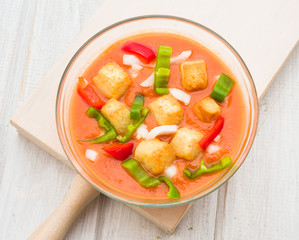 aerial view of gazpacho soup with vegetables and croutons in rou