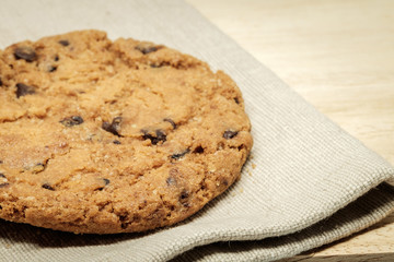 Pastry biscuits on linen napkin on wooden table