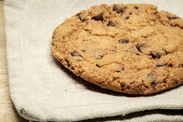 Pastry biscuits on linen napkin on wooden table