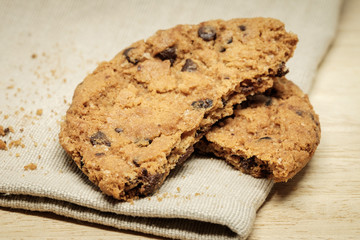 Pastry biscuits on linen napkin on wooden table