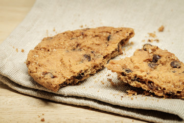 Pastry biscuits on linen napkin on wooden table