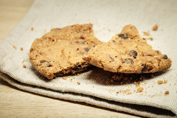 Pastry biscuits on linen napkin on wooden table