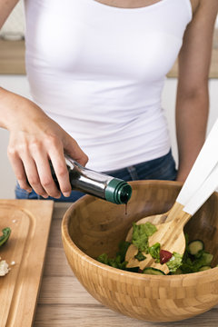 Close-up of woman cooking salad