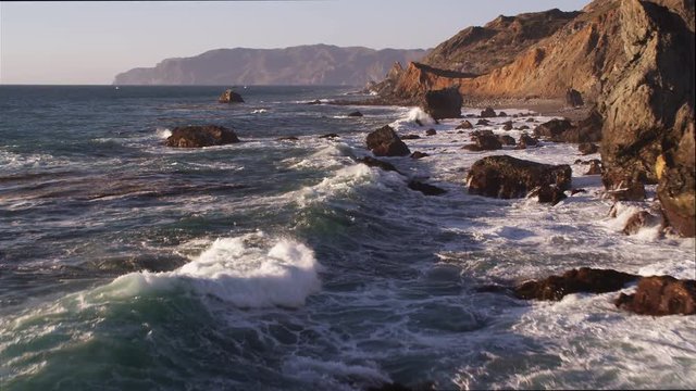 Over surf splashing against rocks along the Catalina coast. Shot in 2010.