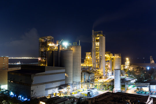 Concrete cement factory at night