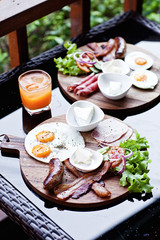 Breakfast - fried egg with bacon and cheese