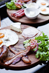 Breakfast - fried egg with bacon and cheese