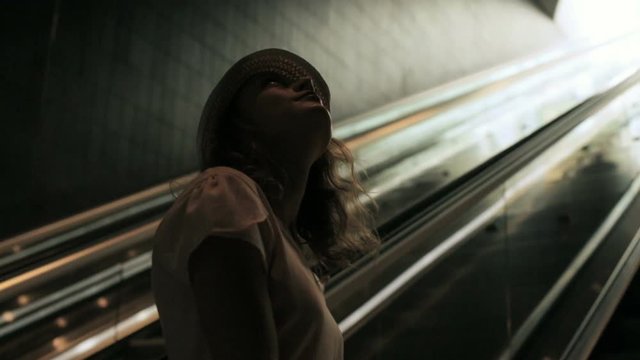 Young woman talking on the phone while traveling on the train