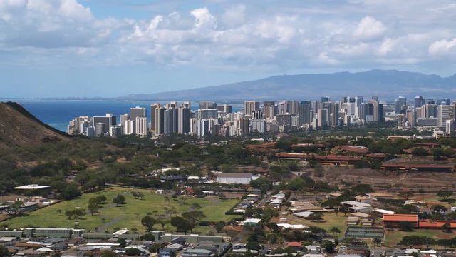 Flying over outskirts of Honolulu, downtown skyline in distance. Shot in 2010.