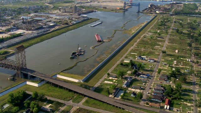 Flight paralleling canal beside Katrina-damaged lots in New Orleans. Shot in 2007.