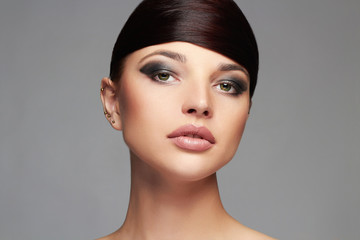 Beautiful Girl.Hairstyle.Makeup. young beauty Woman with shiny Hair