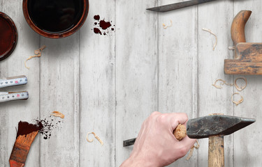Woodworking tools with free space for text. Hammer and chisel in hand, beside is brush, paint, wood...