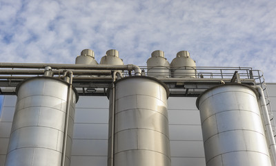 Detail of chemical plant, silos and pipes
