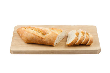 White small bread being cut on wooden board