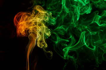 Abstract yellow green smoke from aromatic sticks.