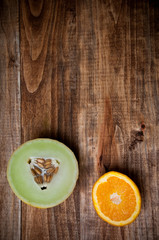 Fresh juicy fruits on a wooden background