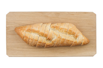 White small bread being cut on wooden board
