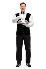 Waiter holding a tray with plastic lid
