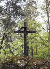 Old cross in forest