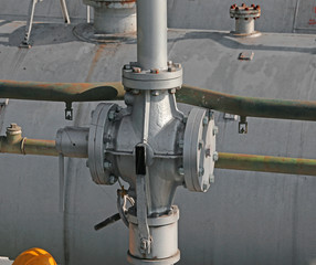 large pipes and safety valve above the gigantic pressure vessel