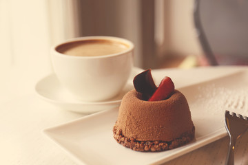 Mini chocolate cake on white plate