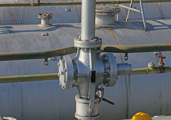 pipes and safety valve above the gigantic pressure vessel for st