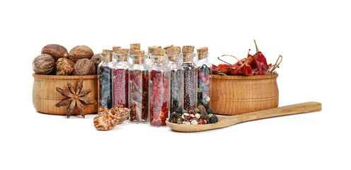 Foto auf Acrylglas Assorted dry spices in glass bottles on white background © Africa Studio