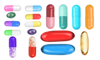 Many colorful pills isolated on white