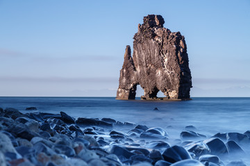 Hvitserkur, giant rock with the shape of a dinosaur at Hunafjoraur, taken at the blue hour with a...