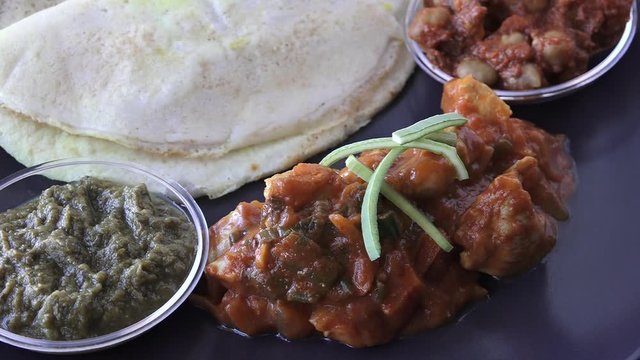 Indian food Chicken Curry served with Dosa with Sambar and Channa Masala. Food background and texture.background and texture.